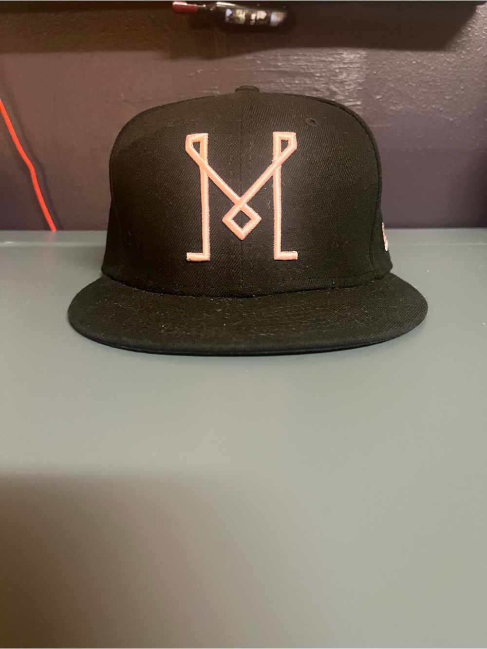 New Era Black Snapback Hat with Pink Embroidered Logo